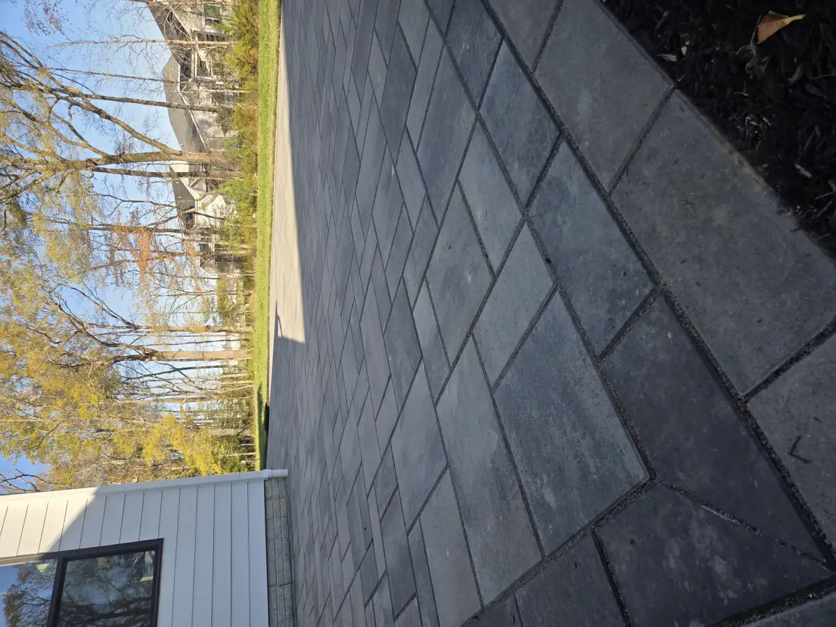 Completed paver patio with detailed pattern work
