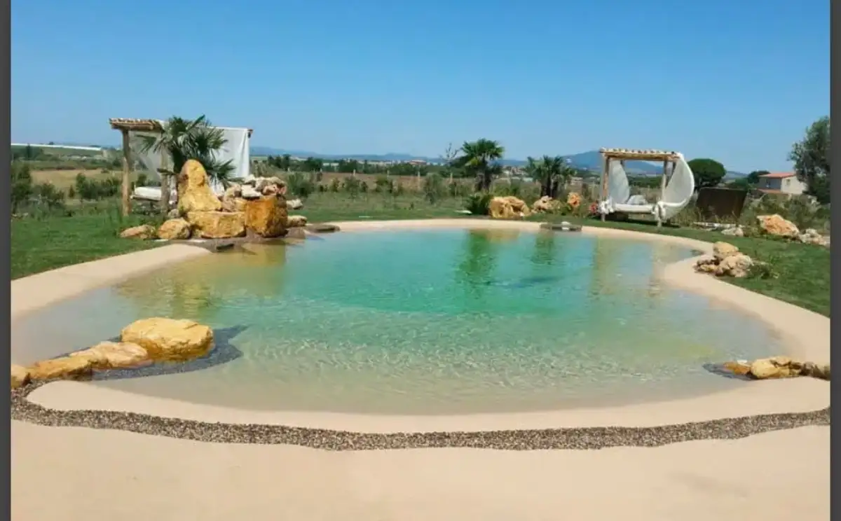 Finished pool project with stone patio in coastal Delaware